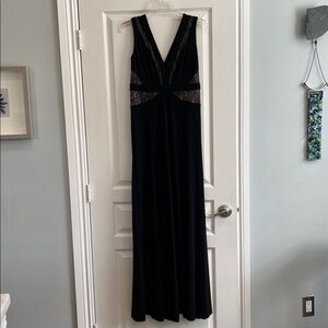 BCBG MAX AZARIA long black and lace dress
Zipper in back and slits in front of